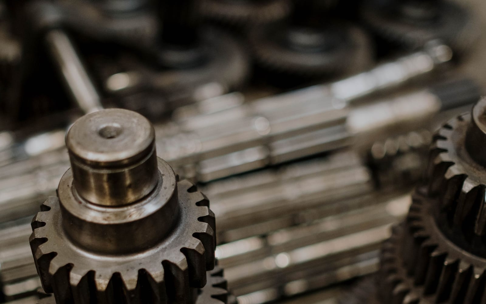 Machined steel gears meshed together in close-up
