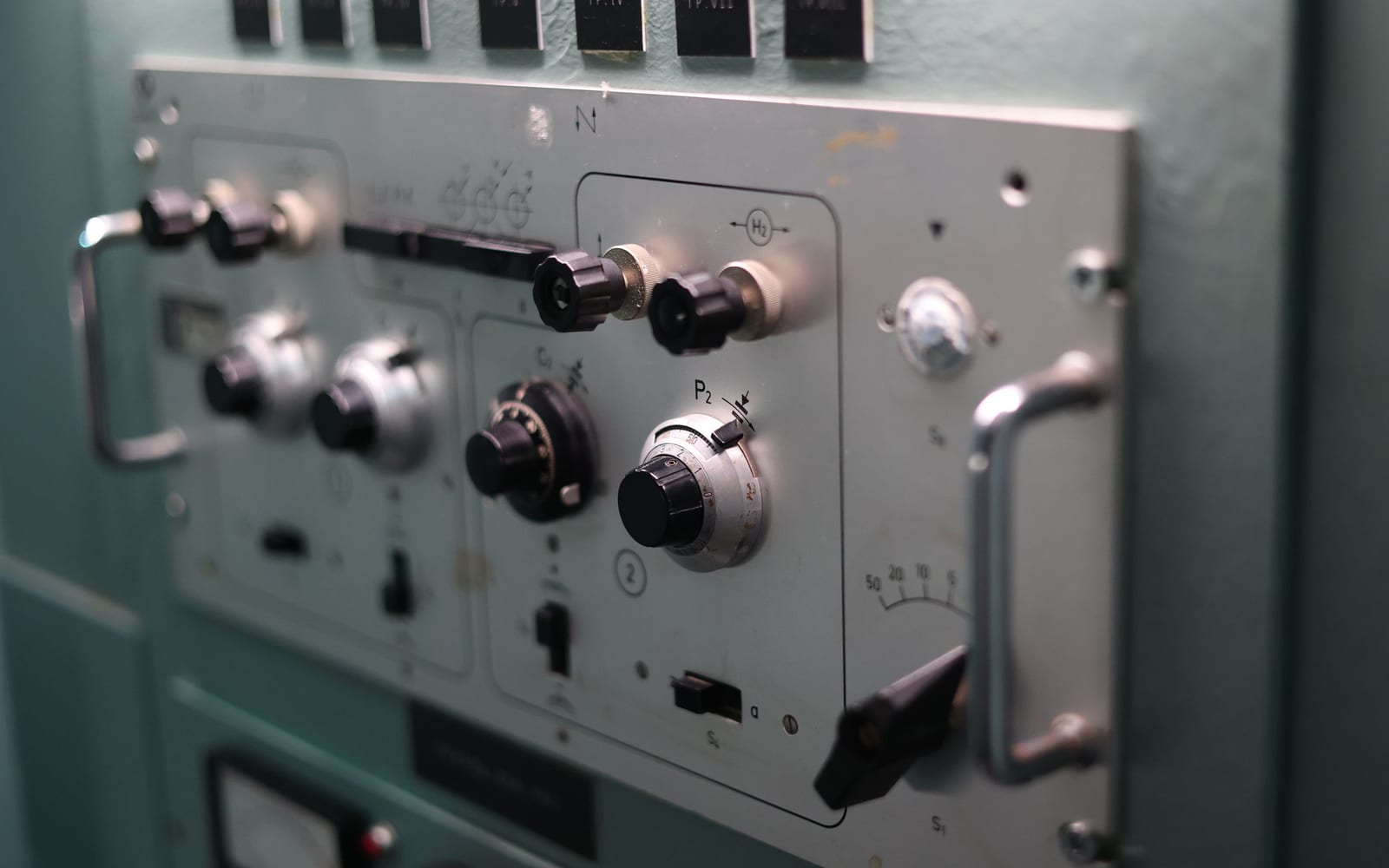 A calibrated analogue control panel with labelled dials and switches