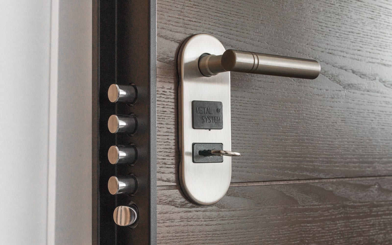 A multi-point door lock showing several independent bolts along the frame