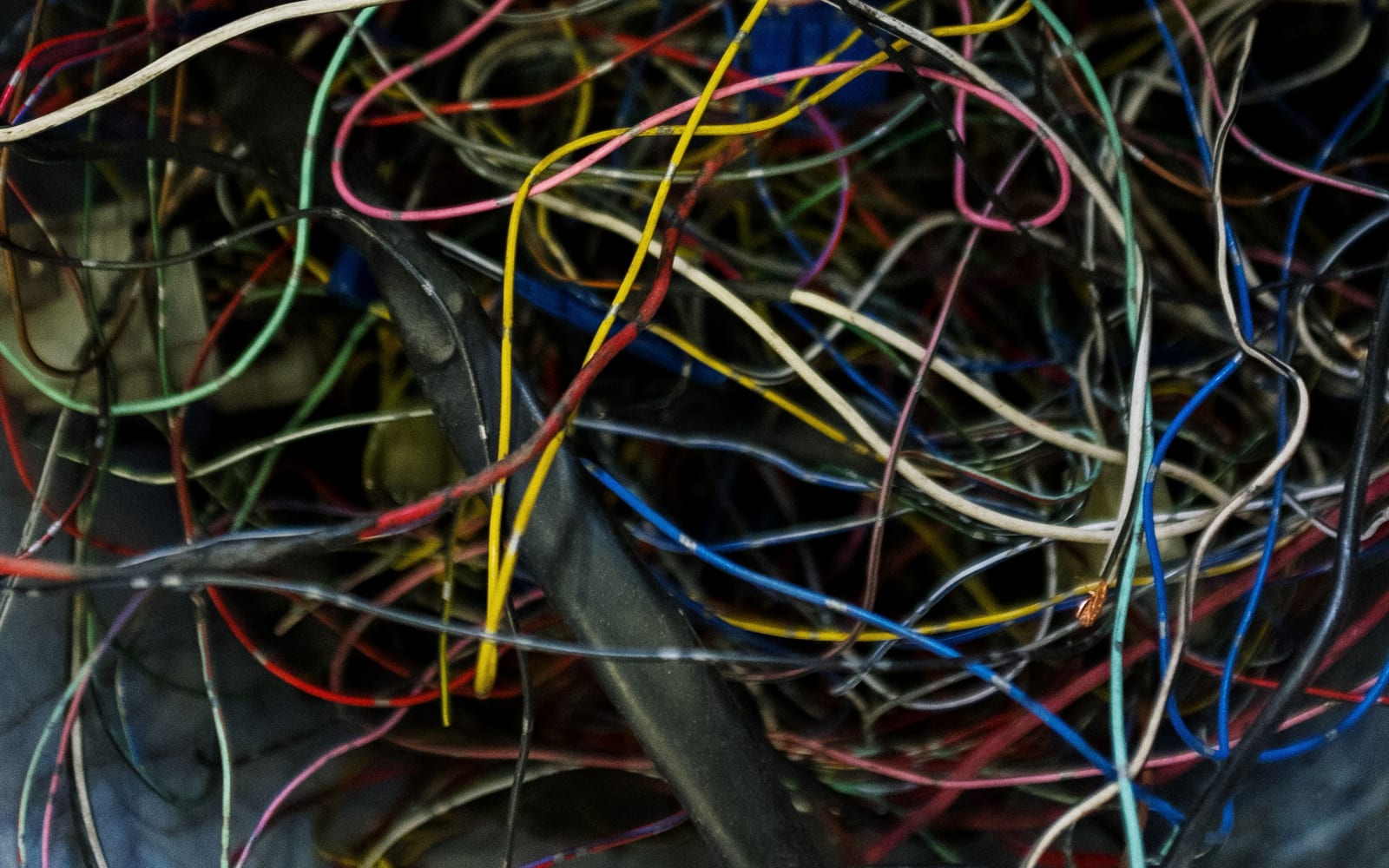A dense tangle of unlabelled coloured wires with no discernible order