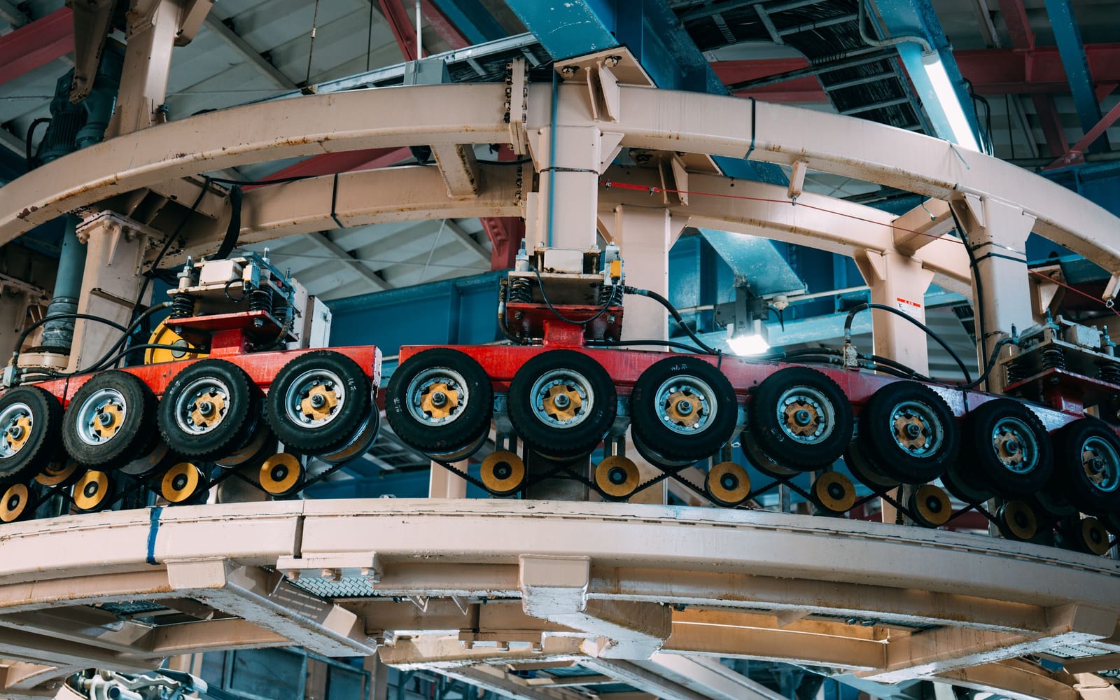 A rotary conveyor with numbered stations, each performing one operation