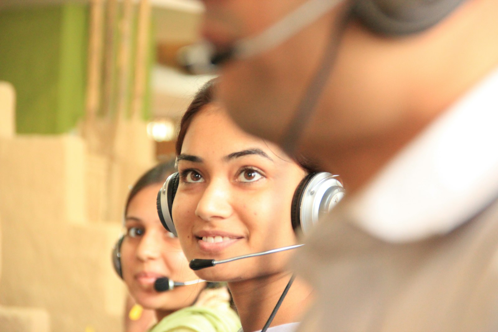 Contact centre floor with agents at workstations, the service operations surface that fails when sell-to-deliver contracts and capacity visibility are missing.