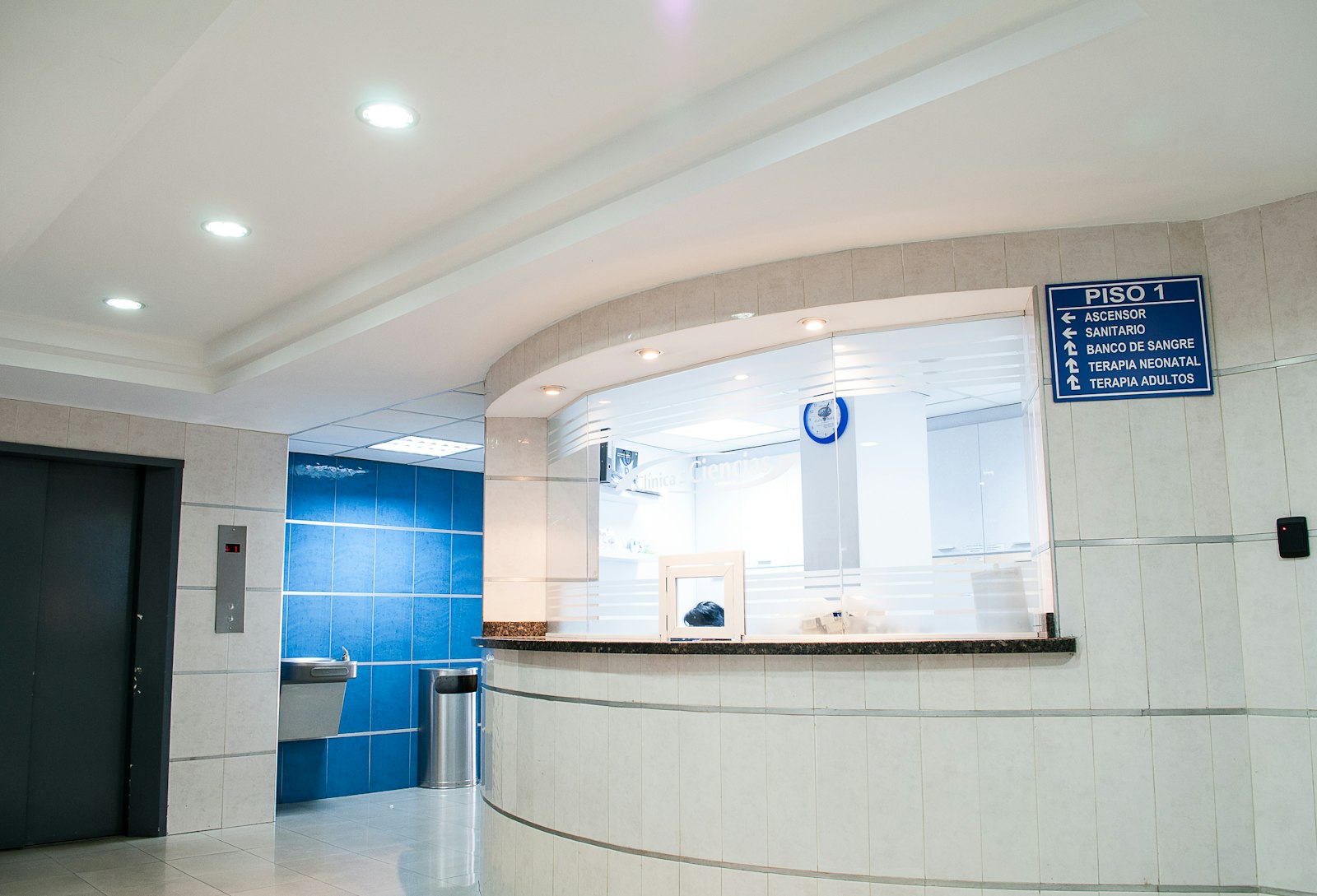 Hospital reception and wayfinding desk, the access and operations surface Health Cloud programs must respect without becoming the clinical record.
