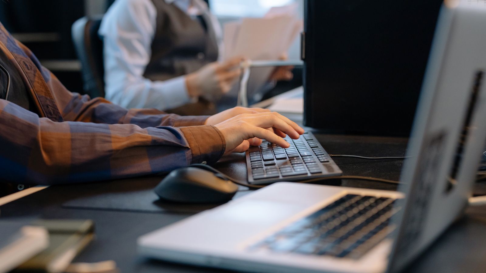 An administrator working at a computer.