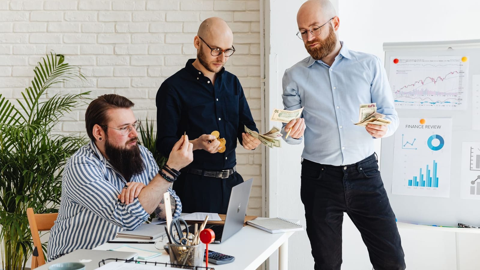 Colleagues discussing a contract renewal in an office.
