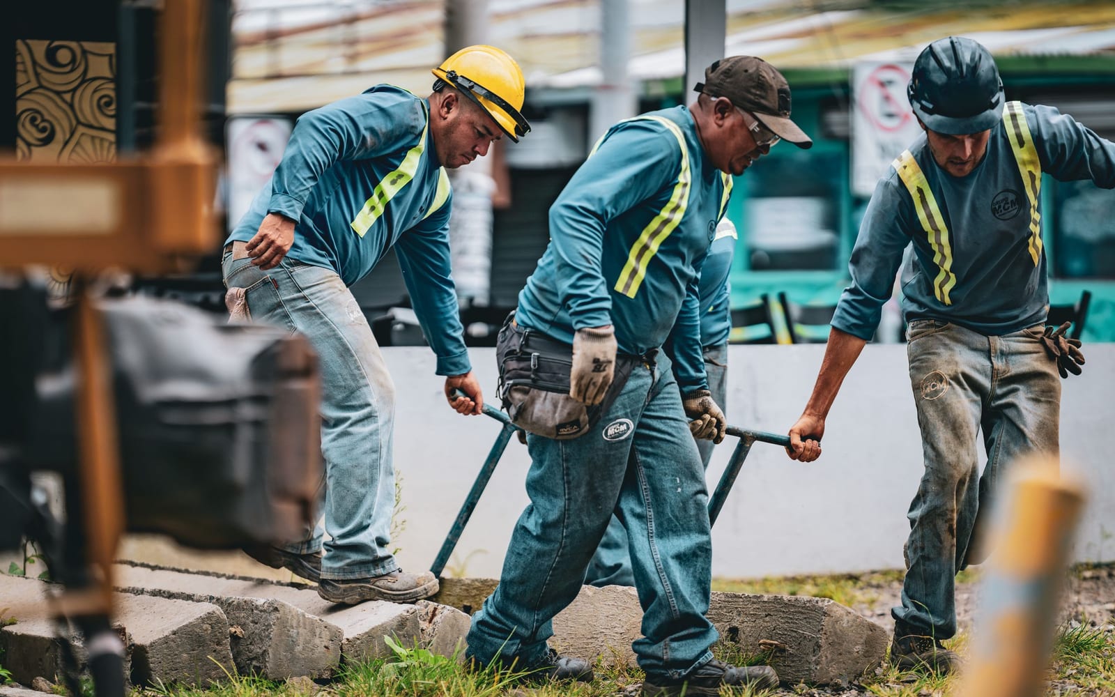 A technician using a tablet on a work site.