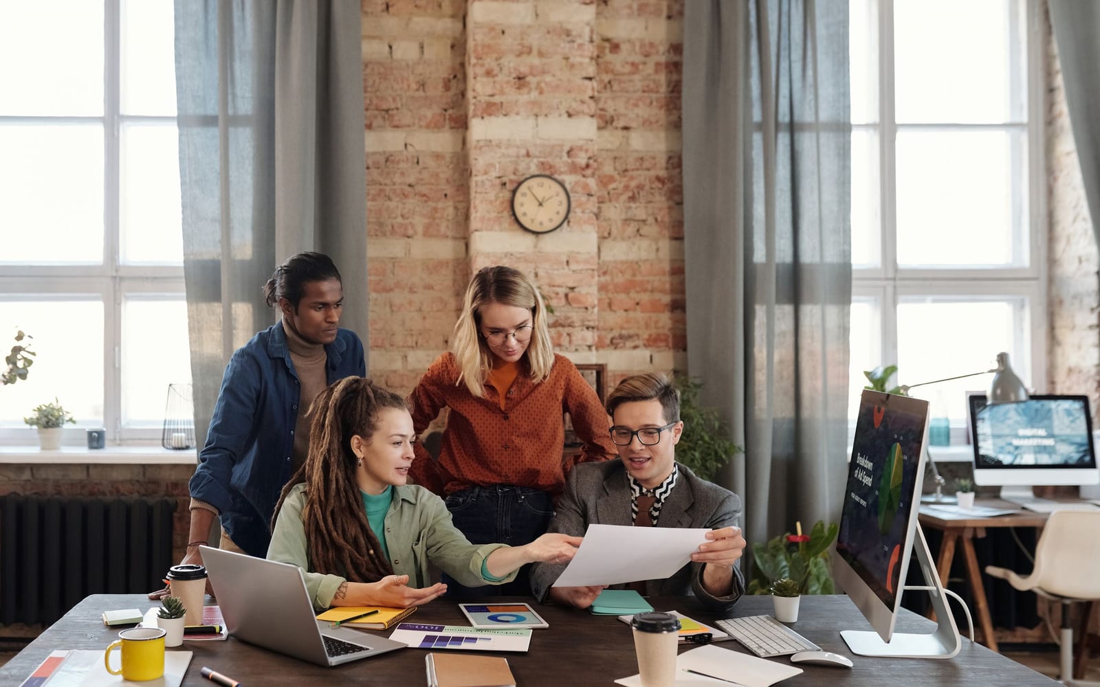 A marketing team working in a modern office.