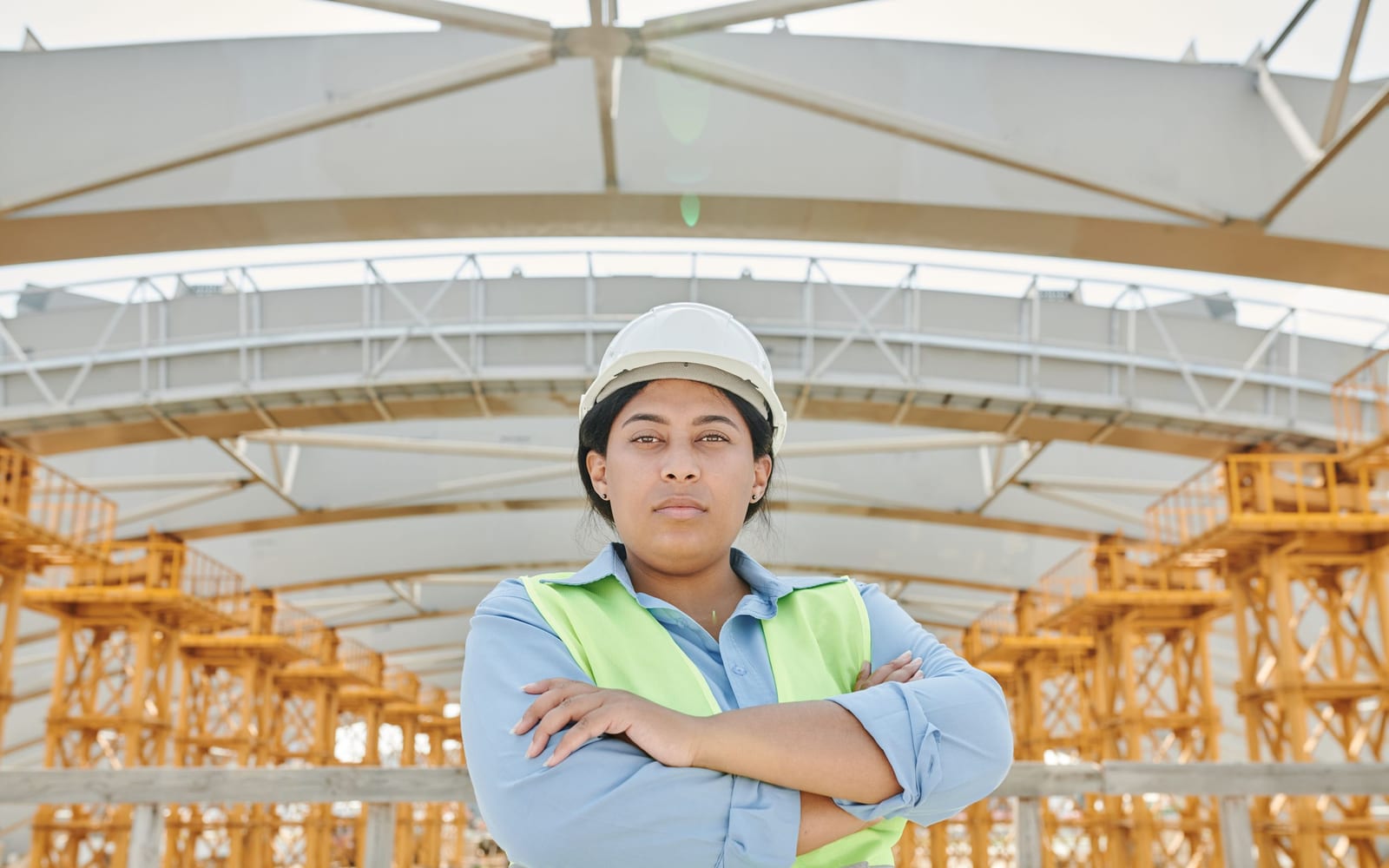 A technician using a tablet on a work site.