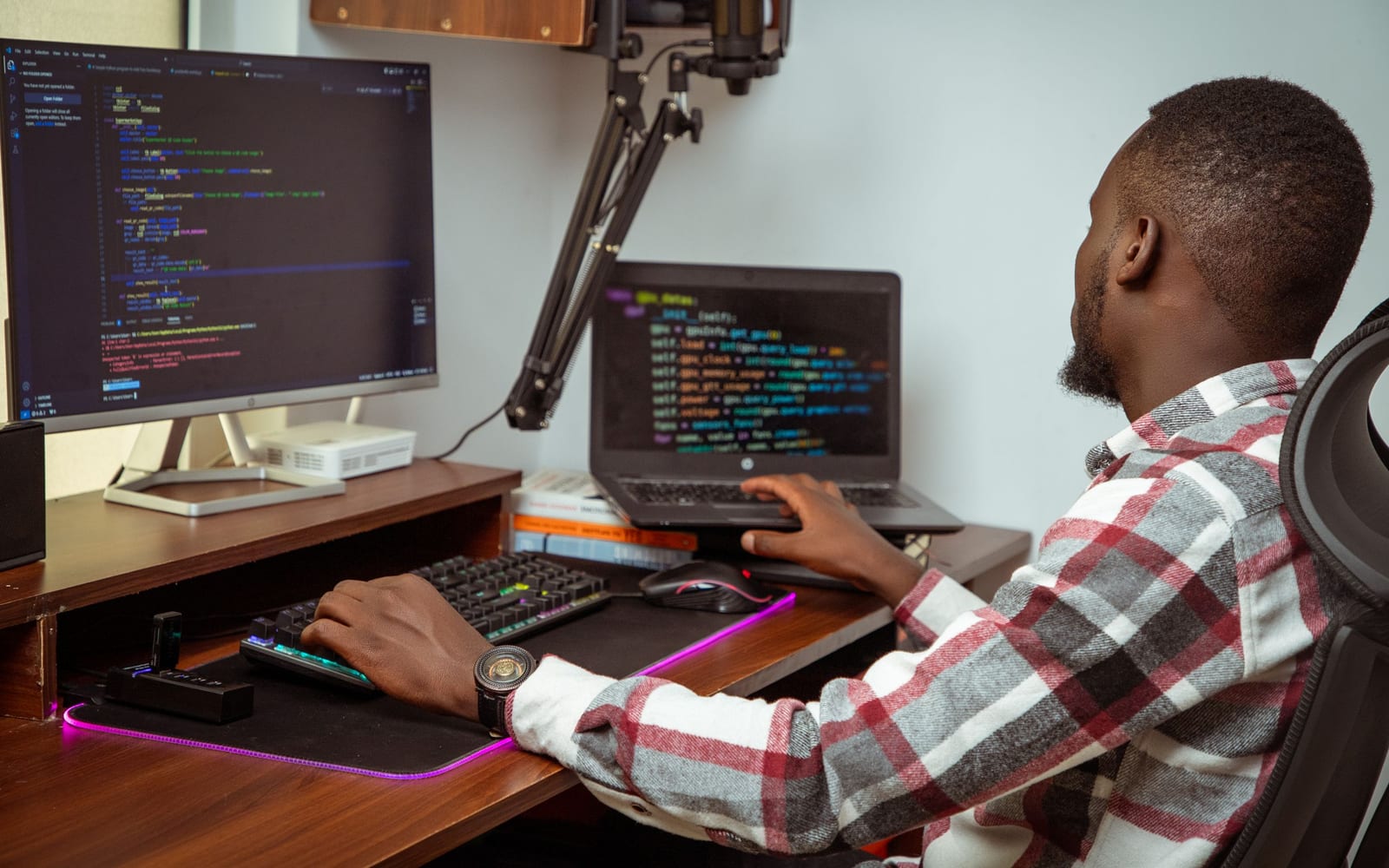 An engineer working beside servers in a data centre.