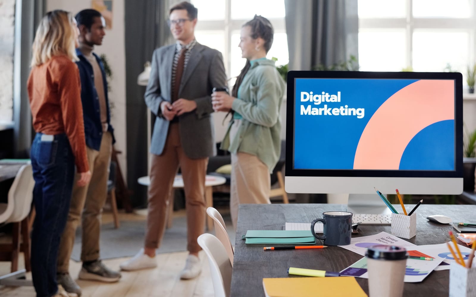 A marketing team working in a modern office.