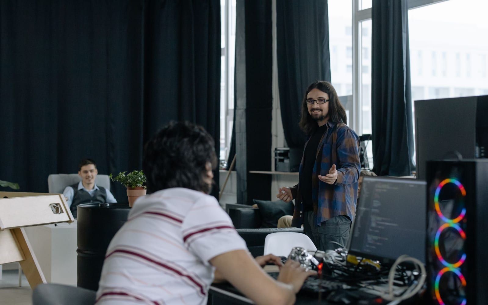 An engineer working beside servers in a data centre.