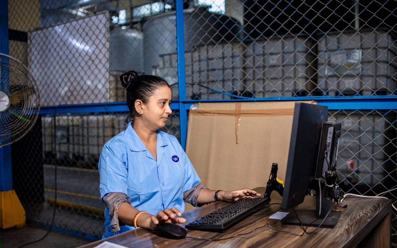 Staff working a warehouse or retail floor.