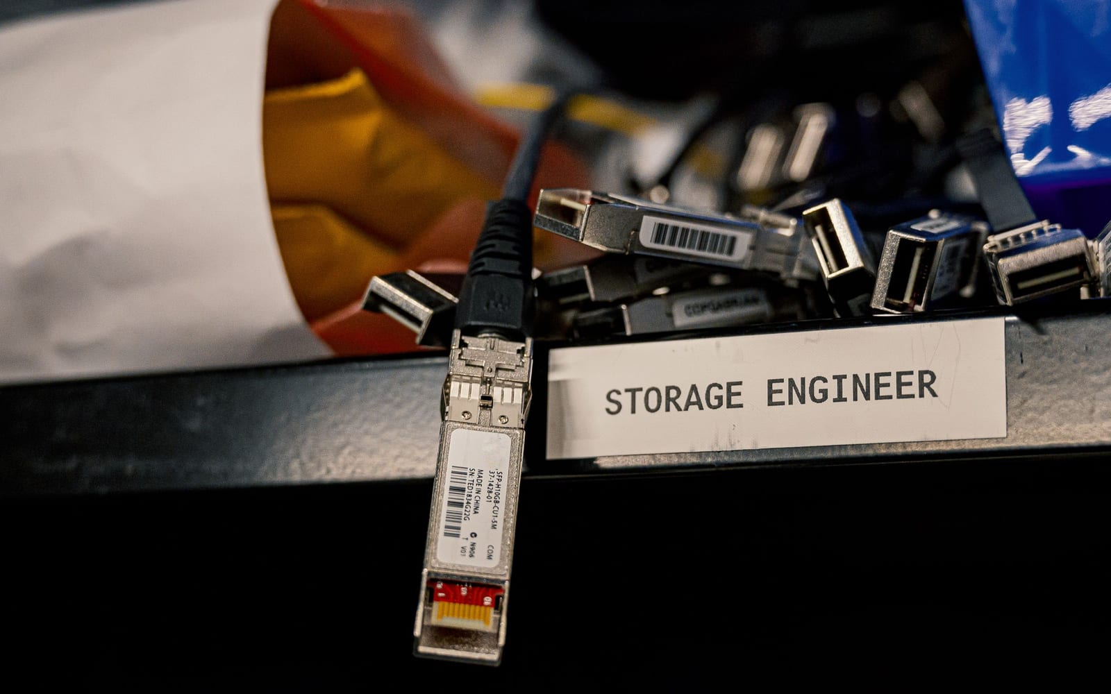 An engineer working beside servers in a data centre.