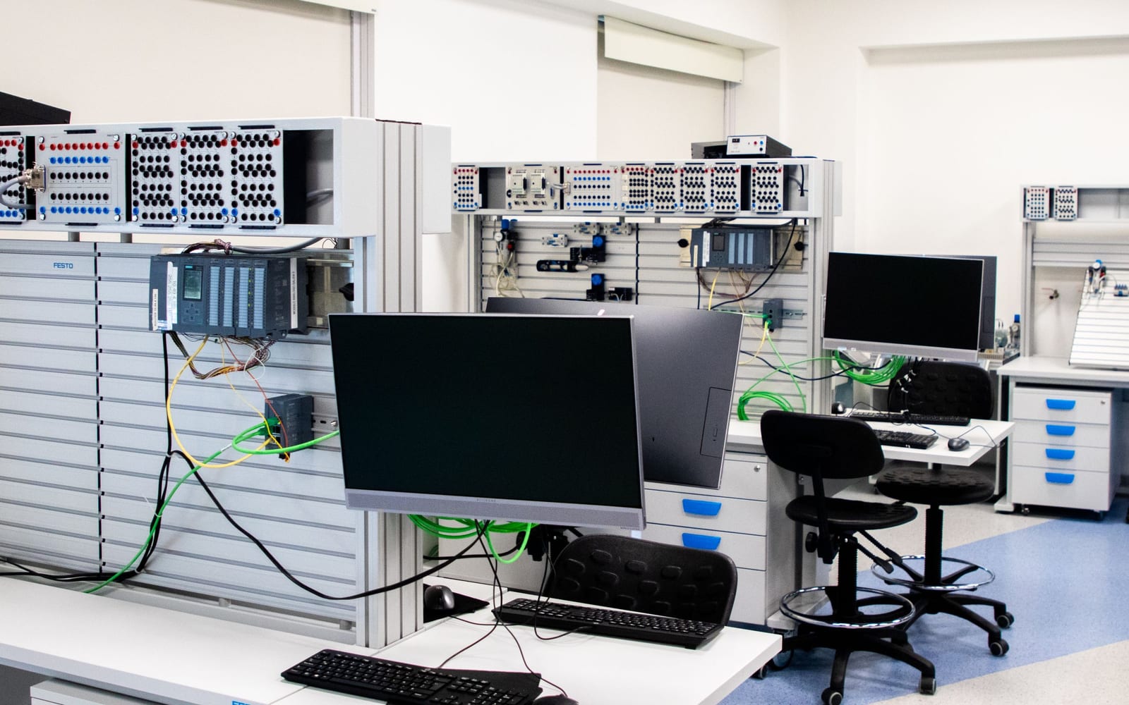 An engineer working beside servers in a data centre.
