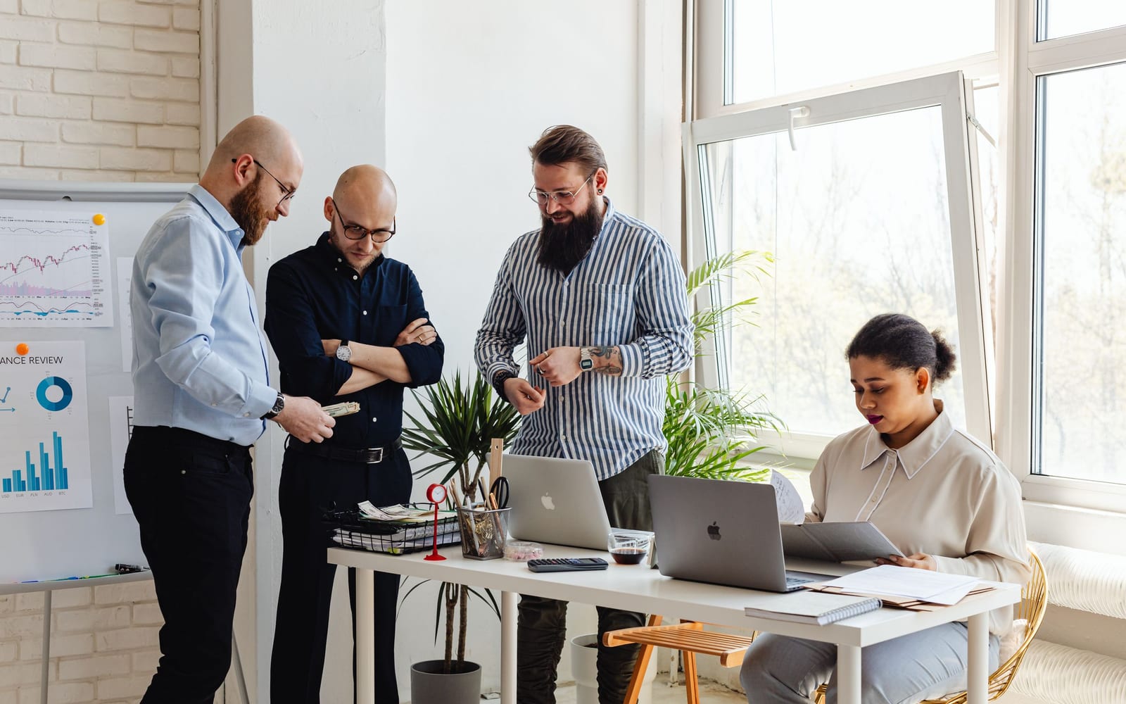 A finance meeting around a conference table.