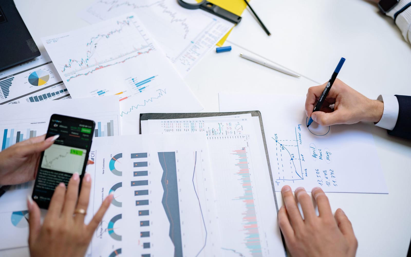 A finance meeting around a conference table.