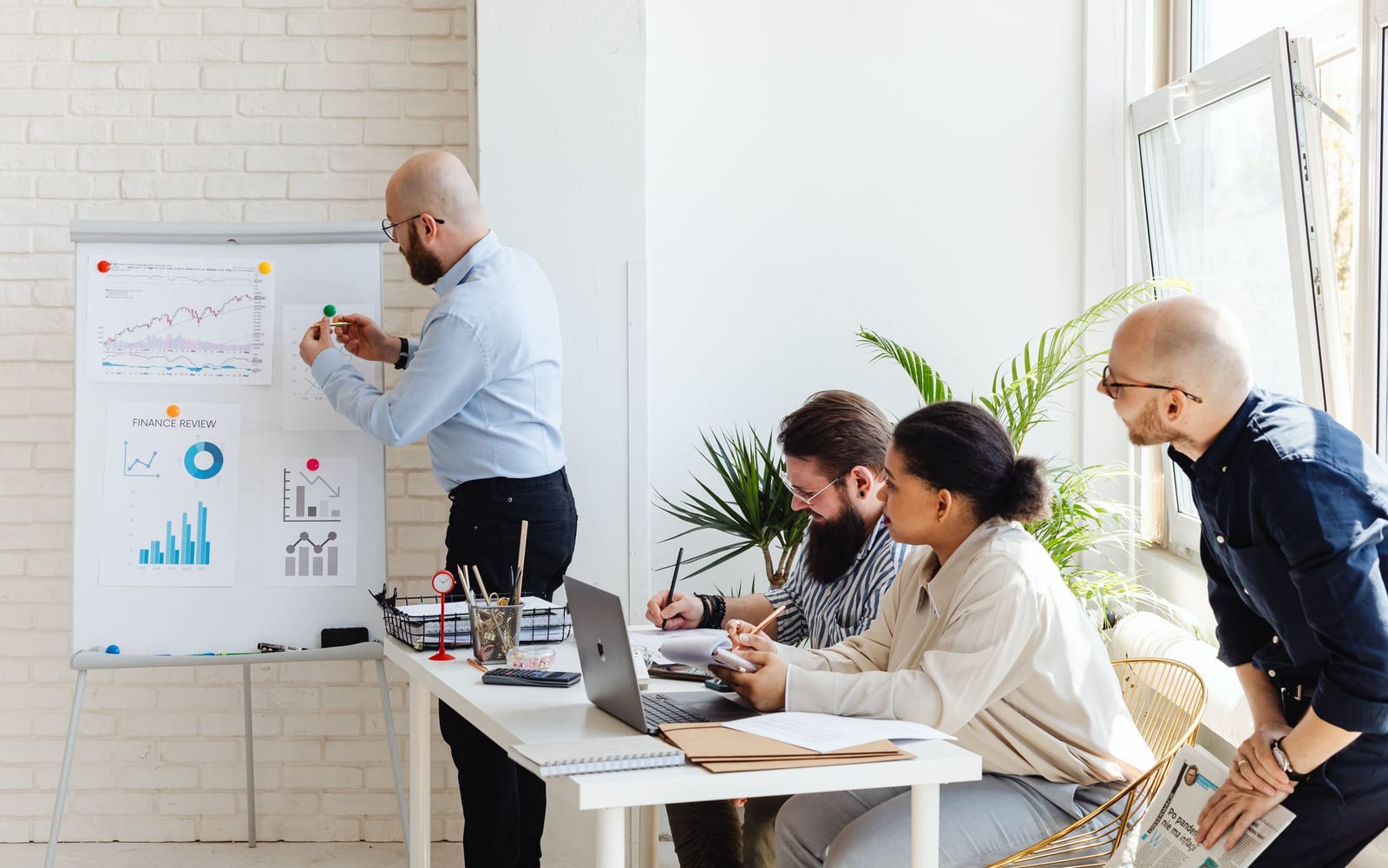 A finance meeting around a conference table.