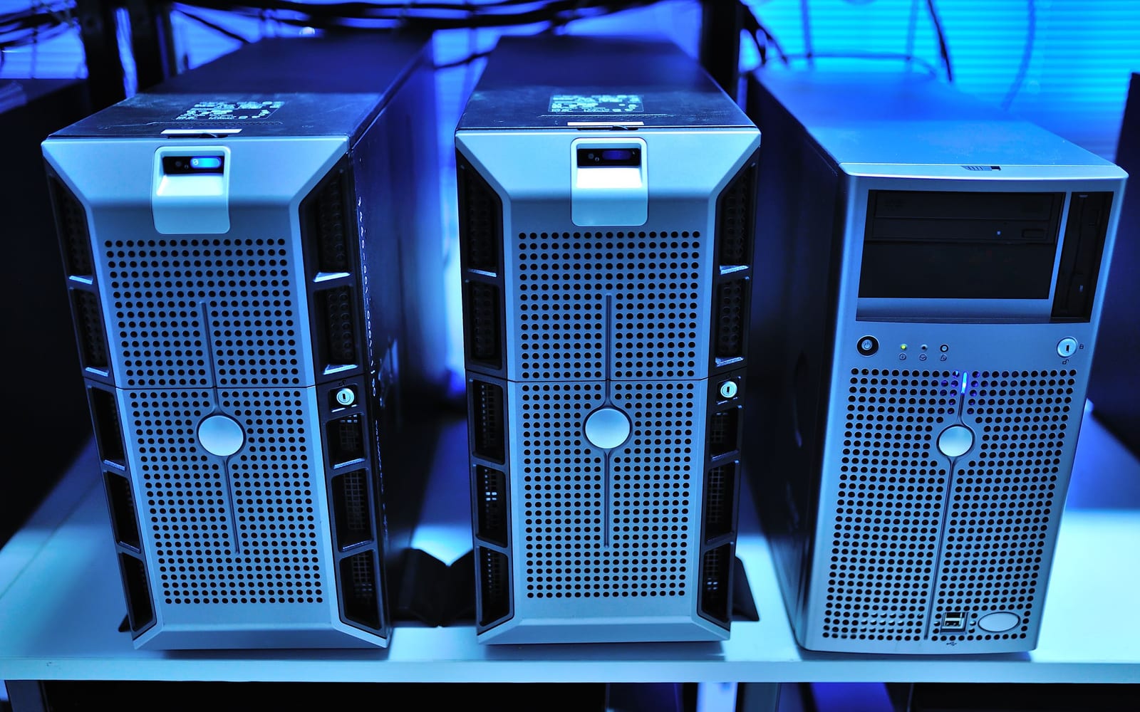 An engineer working beside servers in a data centre.