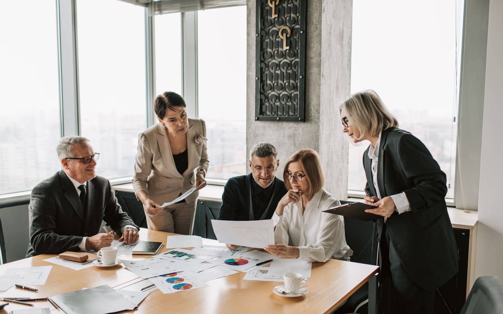 A finance meeting around a conference table.