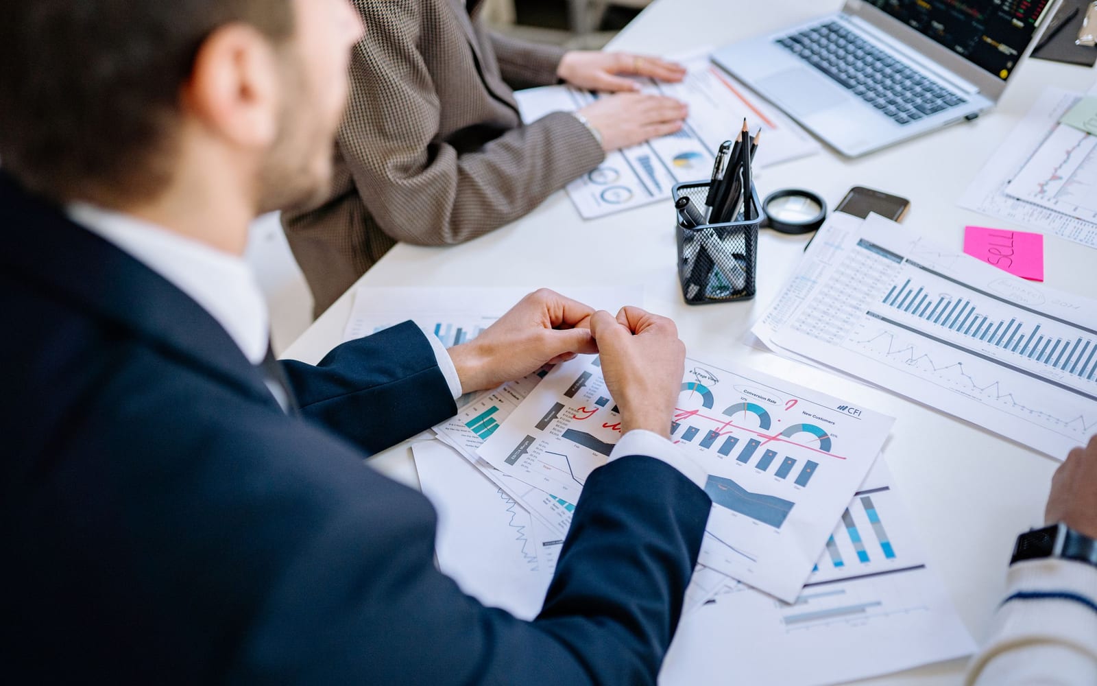 A finance meeting around a conference table.