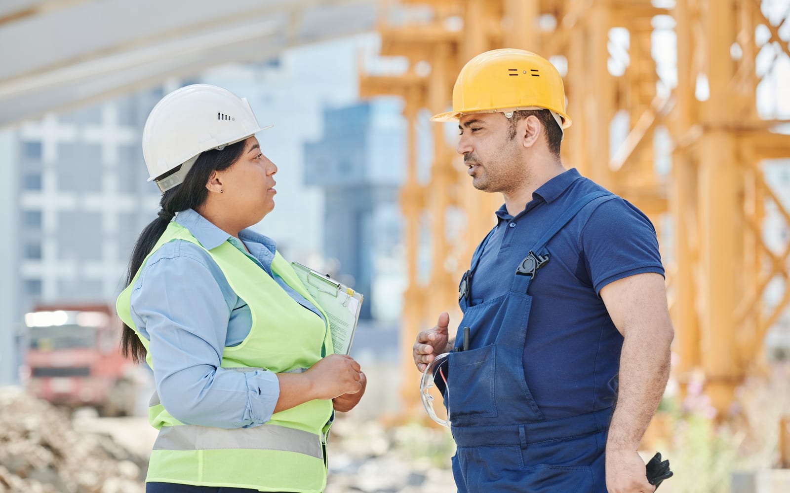 A technician using a tablet on a work site.