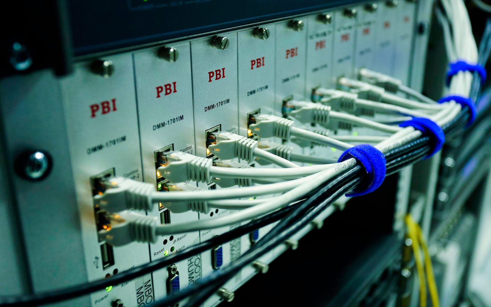 An engineer working beside servers in a data centre.