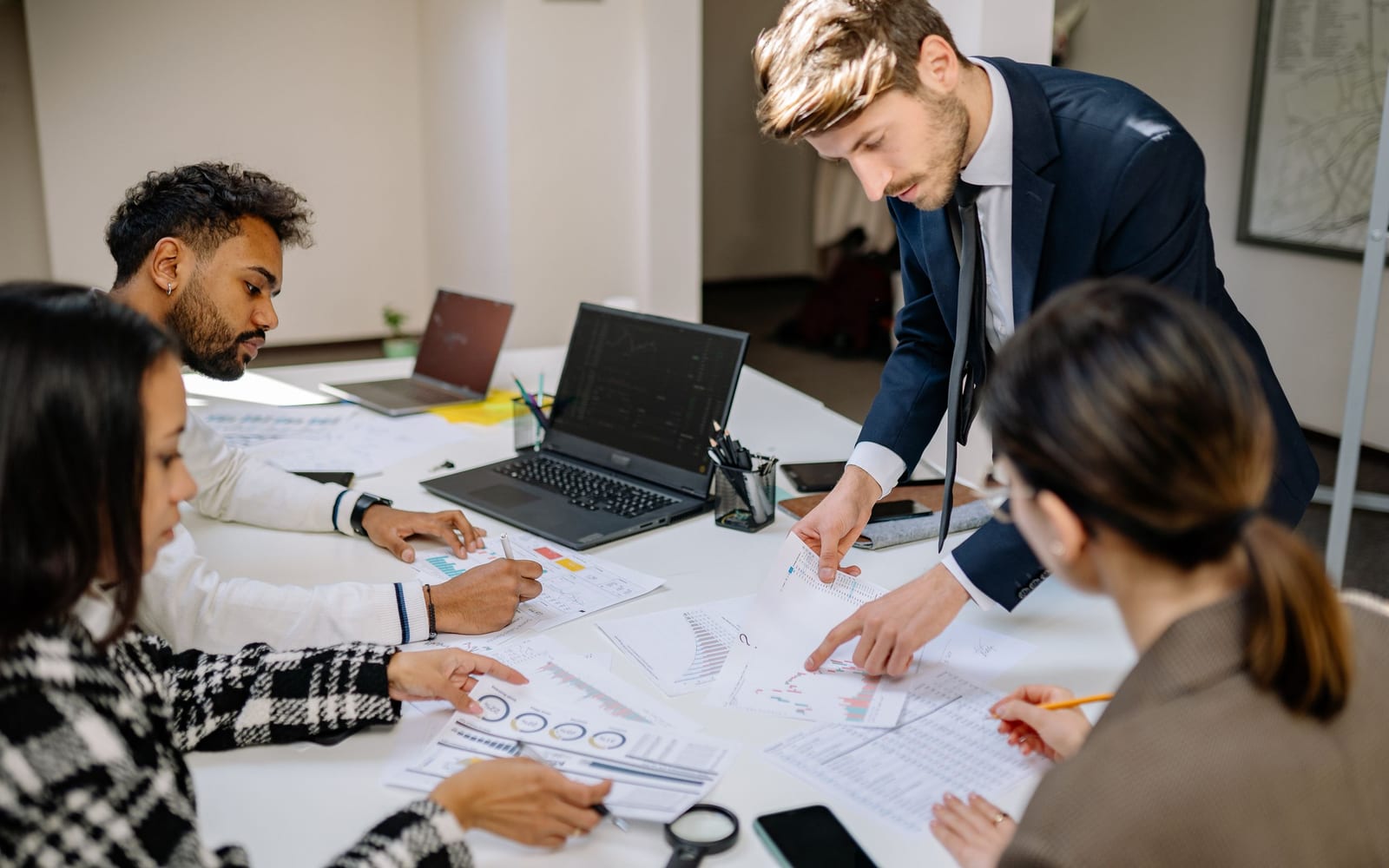 A finance meeting around a conference table.