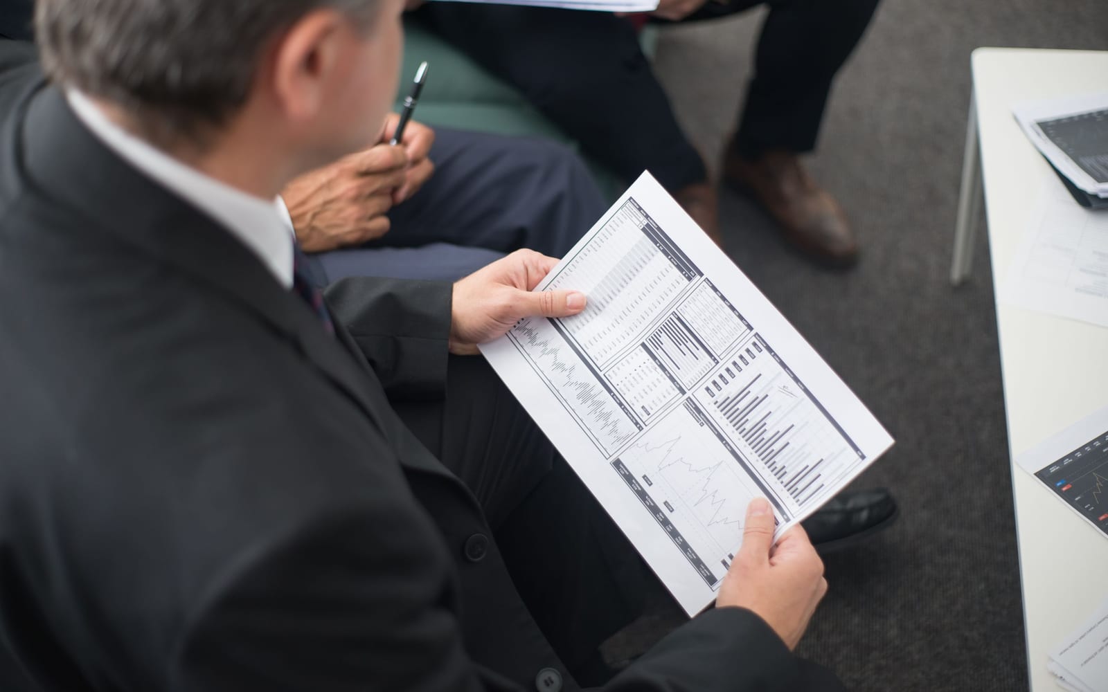 A finance meeting around a conference table.