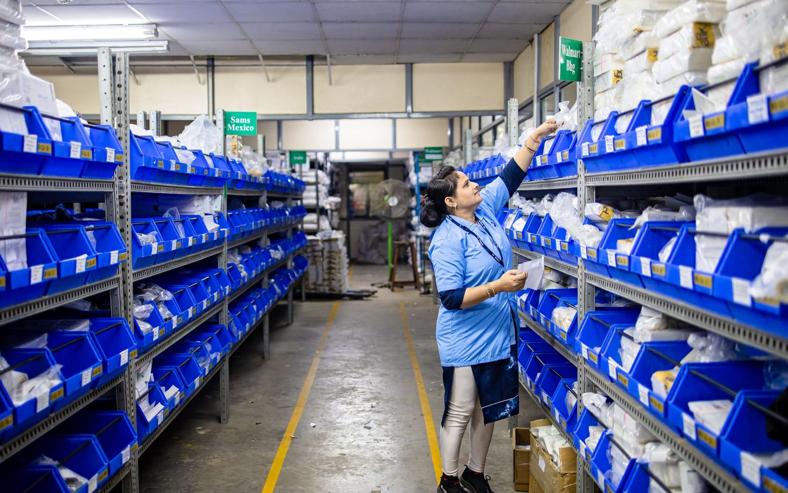 Staff working a warehouse or retail floor.