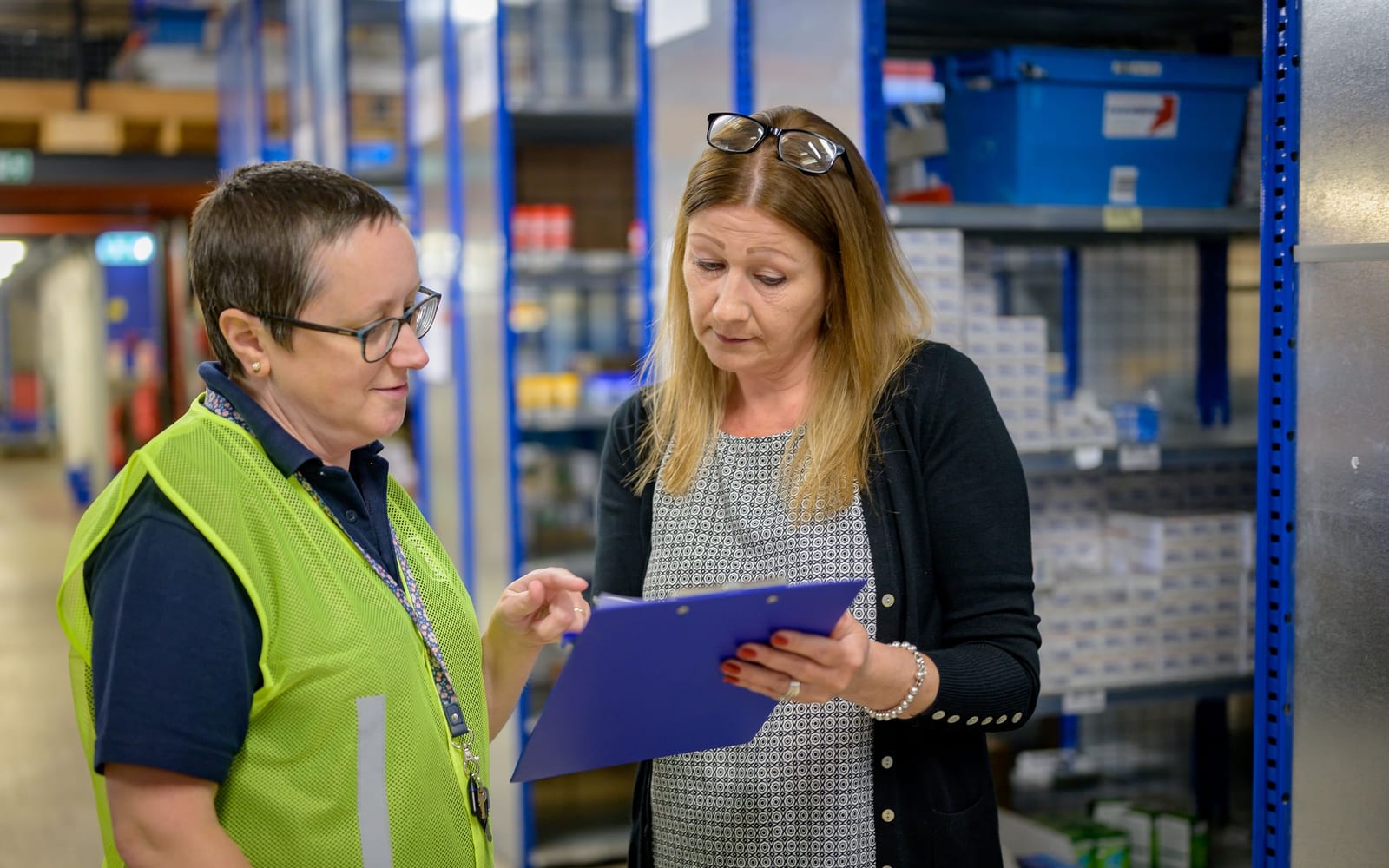 Staff working a warehouse or retail floor.