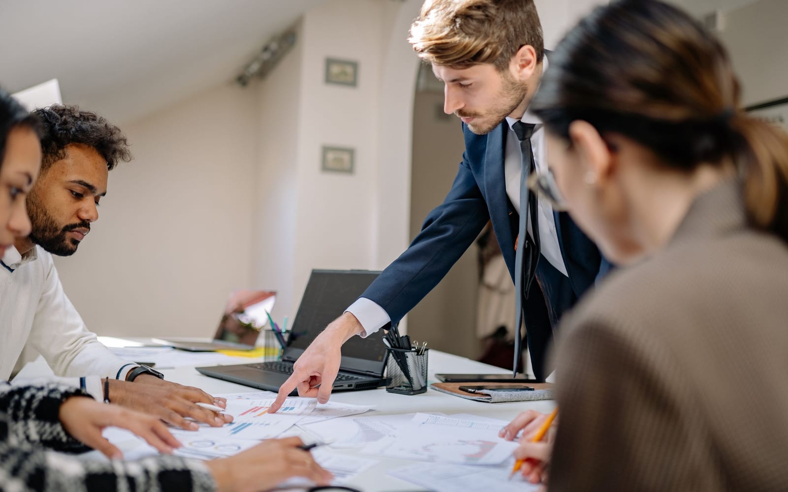 A finance meeting around a conference table.