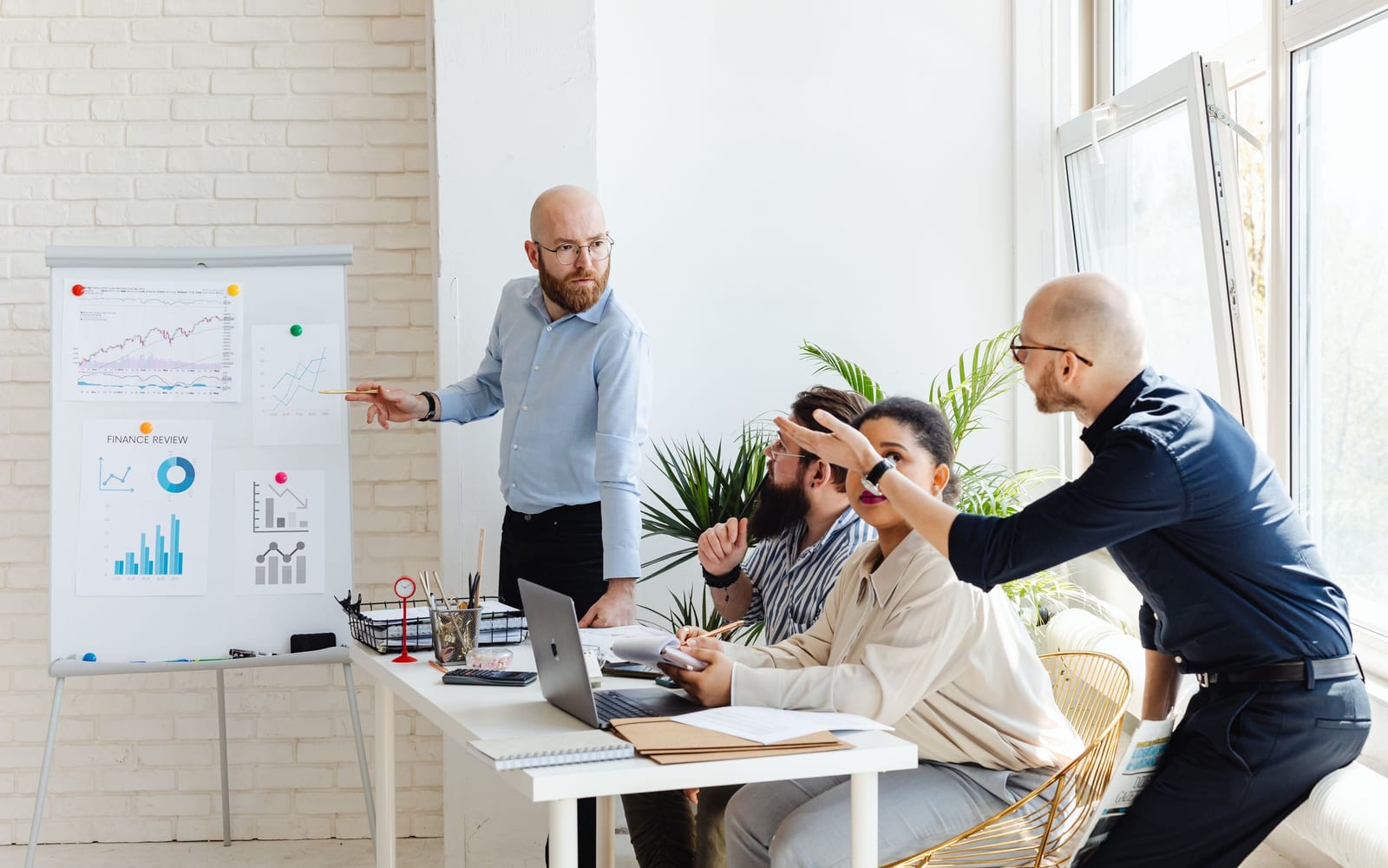A finance meeting around a conference table.